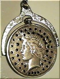 Photo of the actual silver dollar that Clarence Snyder carried for 46 years.